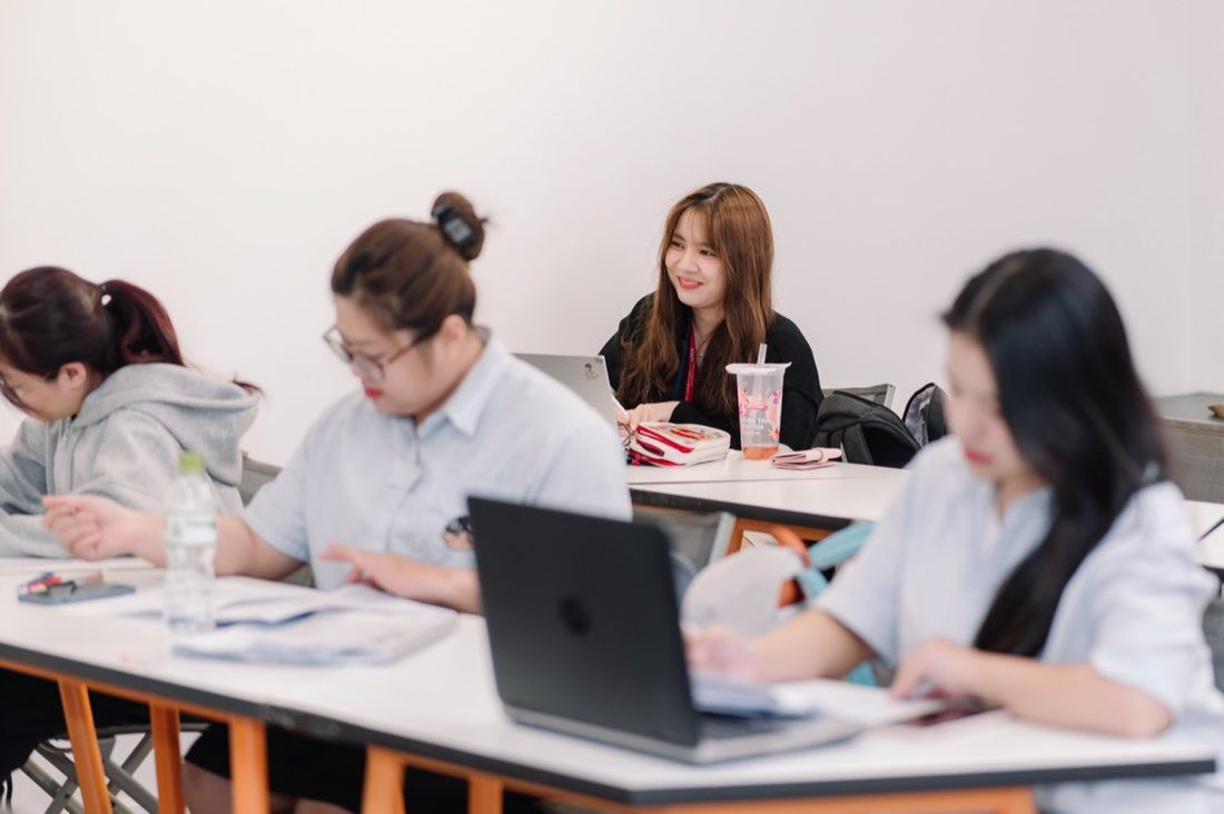Students working on laptops in an 8020 SAT class
